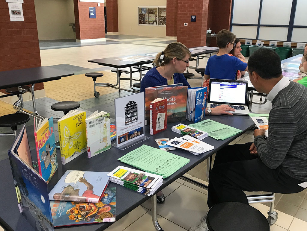 Parents learning about public library resources Parents learning about public library resources