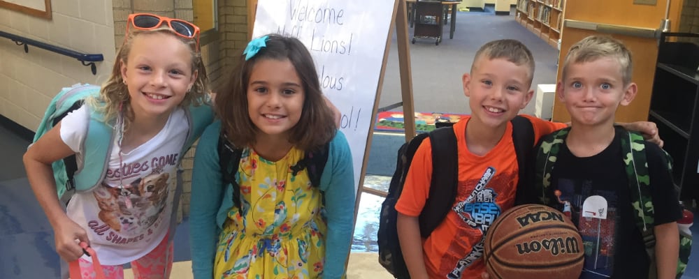 Neff Elementary students smile for the camera on the first day of school