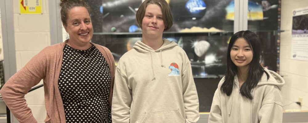 Photo of two students and a teacher