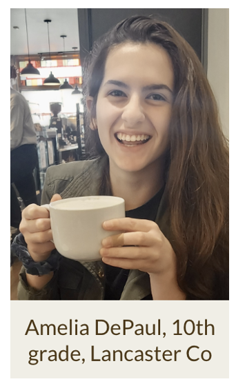 Amelia DePaul holding up a coffee mug