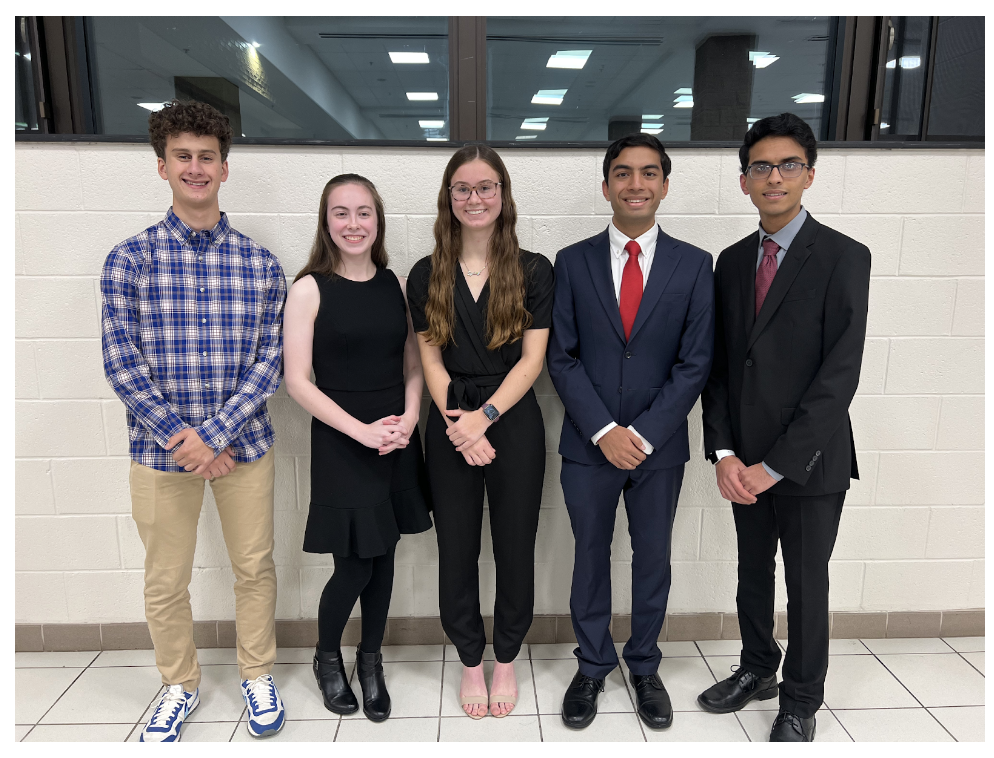 National Merit student recipients standing in front of a white background